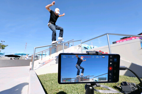 LOS ANGELES, April 6, 2026 — Samsung Electronics has announced that its latest flagship device, the Samsung Galaxy S26 Ultra, was used to film a live Street League Skateboarding (SLS) competition for the first time during the SLS DTLA Takeover held on April 4. The move marks a significant step in the evolution of sports broadcasting, with Samsung integrating its mobile camera technology directly into the skateboarding course. Devices were embedded into key features such as rails, ledges and gaps, offering unique, skater-level perspectives that traditional broadcast cameras are unable to capture. Samsung said the Galaxy S26 Ultra’s pro-grade camera system enables high-quality, broadcast-level performance, combining advanced stabilization, intelligent processing and strong low-light capabilities. The footage captured was fed directly into the live production workflow, allowing near-instant replays and enhancing the overall viewing experience. The initiative builds on Samsung’s earlier efforts in sports broadcasting, including its collaboration with Olympic Broadcasting Services during the Olympic Winter Games Milano Cortina 2026, where Galaxy devices were used to stream segments of the opening ceremony from multiple on-ground angles. “Mobile innovation is opening new possibilities for how sports are captured and experienced,” said Joshua Cho, Executive Vice President at Samsung Electronics. “With Street League Skateboarding, we are bringing cameras directly into the course to deliver entirely new perspectives.” By placing cameras within the action, Samsung aims to highlight the finer details of skateboarding — from speed and mid-air tricks to the precision of landings — offering fans a more immersive and technical view of the sport. According to Brett Clarke, Chief Revenue Officer at Thrill Sports, the parent company of SLS, such collaborations are helping expand the sport’s global reach while preserving its creative identity. The Galaxy S26 Ultra integration will continue throughout the SLS 2026 season, following its initial rollout earlier this year. Samsung said it plans to further explore the use of mobile technology in live broadcasting, particularly in the lead-up to major global sporting events, including Los Angeles 2028 Olympic Games. The development signals a broader shift in the industry, where smartphones are increasingly being positioned as viable tools for professional-grade content production, narrowing the gap between mobile devices and traditional broadcast equipment.