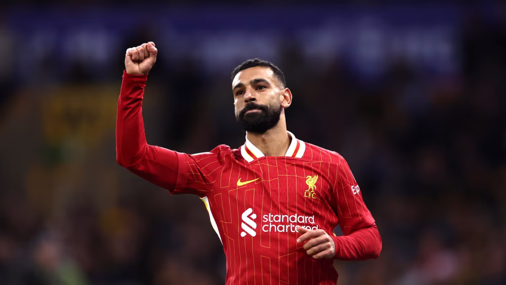 There are great players. There are legends. And then there are players who permanently redefine the identity of a football club. Mohamed Salah was never just another forward for Liverpool. He became the face of Liverpool’s modern revival; the symbol of an era that transformed the club from hopeful contenders into one of Europe’s most feared football institutions once again. Now, as Salah prepares to leave Anfield at the end of the season, it feels less like a normal transfer and more like the closing chapter of an epic story that lasted nearly a decade. And one enormous question now hangs over Liverpool Football Club: Are Liverpool truly ready to live without Mohamed Salah? From “Chelsea Reject” to King of Merseyside Many people forget that Salah’s first spell in English football was widely viewed as a failure. During his time at Chelsea, he struggled for opportunities, failed to fully adapt to the intensity of the Premier League, and was often dismissed as a player who simply was not ready for English football. In modern football, many careers never recover from that label. But Salah chose the difficult path instead of the easy one. He rebuilt himself in Italy, first with Fiorentina and later with AS Roma, where he evolved into a devastating attacking weapon; direct, explosive, clinical, and terrifying in transition. Even then, few expected what would happen next. When Liverpool signed Salah in 2017 under Jürgen Klopp, skepticism surrounded the deal. Many believed the transfer fee was too high for a player they considered “just another fast winger.” That judgment aged horribly. Because Salah did not merely become good. He became a phenomenon. The Arrival That Changed Liverpool Forever Salah’s first season at Liverpool was absurd. Goals arrived every week. Records disappeared constantly. Premier League defenses were torn apart by his movement, finishing, and relentless attacking intelligence. He was not a traditional winger. He was a statistical machine. Almost immediately, Salah transformed Liverpool into something entirely different. Klopp’s aggressive, high-pressing system suddenly had the perfect final piece on the right flank. The trio of Mohamed Salah, Sadio Mané, and Roberto Firmino became one of the most feared attacking combinations of the modern Premier League era. But brutally speaking, Salah was the primary output of that system. While other players experienced fluctuations in form, Salah almost always delivered the same things consistently: goals, assists and constant attacking danger. That is what separates elite players from legends. Consistency. The End of an Era This final season feels different. Salah still remains dangerous. Still decisive. Still capable of changing games within seconds. But there is also the unmistakable feeling of fatigue surrounding a generation that has spent years competing at the highest possible level. Liverpool themselves are entering a major transition: Jürgen Klopp is leaving, the structure of the squad is changing, a new generation is emerging, and the club’s identity is slowly being rebuilt. Salah appears to understand this perfectly. Instead of staying too long and allowing decline to damage his legacy, he seems prepared to leave while still operating at an elite level. Historically, many football legends remain at clubs long enough for supporters to remember the decline more than the greatness. Salah appears determined not to let that happen. And that may be one of the smartest decisions of his career. The Tragic Greatness of Liverpool’s Klopp Era Perhaps the biggest debate surrounding this Liverpool generation is whether they should have won far more than they actually did. The unfortunate reality is that Liverpool existed during the era of Pep Guardiola and Manchester City, a machine-like football empire that constantly pushed the standards of English football to impossible levels. In another era, this Liverpool side may have: won multiple Premier League titles, built a true dynasty, and been universally recognised as one of the greatest teams in football history. Instead, history will only see the trophies, not the context behind them. And that makes the Salah era feel slightly tragic despite its brilliance. Is Mohamed Salah Liverpool’s Greatest Modern Player? Statistically, the argument is extremely strong. In terms of impact, it may be even stronger. Salah did not simply score goals for Liverpool. He helped restore the club to European football’s elite level once again. He: ended Liverpool’s long Premier League title drought, helped deliver the UEFA Champions League, elevated the standards of the entire club, and turned Liverpool back into a team feared across Europe. For many supporters, he became the defining face of modern Liverpool itself. Liverpool After Salah Could Be Dangerous — And Not in a Good Way Replacing Mohamed Salah is not as simple as signing another winger. Liverpool are not just losing goals. They are losing: leadership, durability, consistency, fear factor, and an almost guaranteed source of elite attacking production. Football today is filled with talented players. But players capable of delivering world-class output for nearly an entire decade are extraordinarily rare. That is legendary territory. And Liverpool’s biggest challenge may not be finding another talented forward. It may be accepting that players like Salah do not appear often within a single generation. What Comes Next for Salah? Many expect Salah’s next destination to be Saudi Arabia, where massive financial projects continue attracting football’s biggest global stars. And honestly, he no longer has anything left to prove. His legacy is already complete. He arrived in England as a player once considered a failure. He leaves as one of the greatest players in Premier League history. That transformation alone is extraordinary. The End of Liverpool’s Modern Identity Mohamed Salah leaving Liverpool is not merely the departure of a footballer. It represents the ending of an entire Liverpool identity. An identity built upon: relentless high pressing, lightning-fast attacks, chaotic European nights at Anfield, and a team capable of frightening the biggest clubs in world football. Salah became the face of that era. And when he leaves, Liverpool will not simply lose a forward. They will lose a symbol. Which is why the biggest question facing Liverpool today is no longer: “Who replaces Mohamed Salah?” But rather: “Will Liverpool ever find another player like him again within this generation?” -- MINUTESMY / SUGAN BALAN
