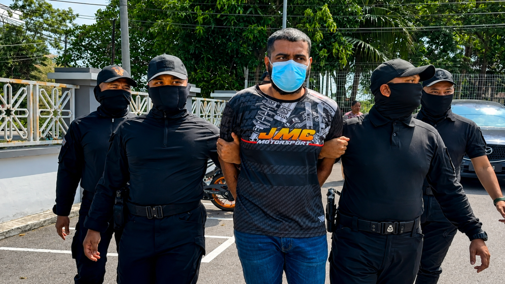 JASIN, JUNE 23 -- An unemployed man was charged in the Magistrate's Court here with murdering a businessman in front of a barber shop in Rim here, two years ago. P Kogilanathan, 27, nodded in understanding after the charge was read out by a court interpreter before Magistrate Mazana Sinin. However, no confession was recorded from the accused as the murder case falls under the jurisdiction of the High Court. According to the charge, Kogilanathan, together with three other individuals who are still at large, are charged with murdering M Vinurd, 24, in front of a barber shop in Taman Rim Baru here, between 8.39 and 11pm, August 25, 2024. The prosecution was carried out under Section 302 of the Penal Code which provides for the death penalty or imprisonment for not less than 30 years and not more than 40 years and, if not sentenced to death, at least 12 strokes of the cane. The prosecution was conducted by Deputy Public Prosecutor, Noor Syazwani Mohamad Yusri, while the accused was represented by lawyer Nur Aida Md Zainuddin. Meanwhile, in another separate proceeding at the same court, Kogilanathan pleaded not guilty to a charge of reckless driving and endangering the public at South Asia Park, at about 7.30pm, March 4, 2024. He was charged under Section 42(1) of the Road Transport Act 1987 (Amendment) 2020 which provides for a maximum prison sentence of five years and a fine of between RM5,000 and RM15,000, as well as disqualification from holding or obtaining a driving licence for a period of not less than five years from the date of conviction. Noor Syazwani offered bail of RM10,000 while Nur Aida requested a lower amount on the grounds that the accused was unemployed and had to support his father who had heart disease and his mother who had diabetes. The court granted bail of RM4,000 for the reckless and dangerous driving charge, but the accused remained in custody on the murder charge. The court set August 26 for the case to be mentioned again. -- BERNAMA