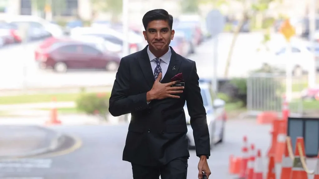 PUTRAJAYA, July 13 — Tension gripped the Federal Court on Monday as the fate of Muar Member of Parliament Syed Saddiq Syed Abdul Rahman hung in the balance following a split decision among a three-member judicial panel hearing the prosecution's final appeal. The courtroom fell silent after the first two judges delivered opposing views, leaving the final outcome to the third judge. Throughout the proceedings, the 34-year-old former Youth and Sports Minister, seated alone outside the dock, remained composed with his head bowed as he listened to the judgments. Court of Appeal President Datuk Seri Abu Bakar Jais, who chaired the panel, was the first to deliver his judgment. He ruled that Syed Saddiq should be acquitted of the first charge of abetting criminal breach of trust involving RM1 million. However, Abu Bakar found the former Malaysian United Democratic Alliance (MUDA) president guilty of one charge of misappropriation of RM120,000 and two money laundering charges involving RM50,000 each linked to funds belonging to Angkatan Bersatu Anak Muda (ARMADA). He proposed a sentence of six months' imprisonment and one stroke of the cane for the misappropriation offence. For each money laundering charge, he proposed six months' imprisonment and a RM5 million fine, with an additional two years' jail for each count in default of payment. The proceedings then took a dramatic turn when Federal Court judge Datuk Che Mohd Ruzima Ghazali delivered a dissenting judgment, disagreeing with Abu Bakar's findings. Che Mohd Ruzima upheld the Court of Appeal's earlier ruling, saying the conviction was unsafe and should not be reinstated. He found that the prosecution had failed to prove essential elements of the offences, including allegations that Syed Saddiq had dishonestly misappropriated RM120,000 belonging to ARMADA. He also noted that there was no evidence showing the funds collected were owned by Armada Bumi Bersatu Enterprise, weakening the prosecution's case. With one judge favouring conviction and another supporting acquittal, the appeal stood evenly split, leaving the final verdict to Federal Court judge Datuk Collin Lawrence Sequerah. Recognising the significance of the moment, Abu Bakar informed both the prosecution and defence that the final decision would depend on Sequerah's judgment and asked whether they wished to take a short break before proceedings continued. Deputy Public Prosecutor Datuk Wan Shaharuddin Wan Ladin responded humorously, saying, "I need to go to the restroom," prompting the court to adjourn for 10 minutes. When the hearing resumed, family members and supporters of Syed Saddiq watched anxiously from the public gallery as Sequerah began reading his judgment. Sequerah ultimately agreed with Che Mohd Ruzima, holding that the Court of Appeal had correctly found that the prosecution failed to prove its case beyond reasonable doubt. "The respondent was lawfully entitled to the funds. I agree with the findings of the Court of Appeal and find no error that warrants appellate intervention," he said. His decision resulted in a 2-1 majority ruling dismissing the prosecution's appeal and fully acquitting Syed Saddiq of all charges. The judgment was immediately followed by applause and cheers from Syed Saddiq's family members and supporters inside the courtroom, bringing an emotional conclusion to the high-profile case. -- MINUTESMY