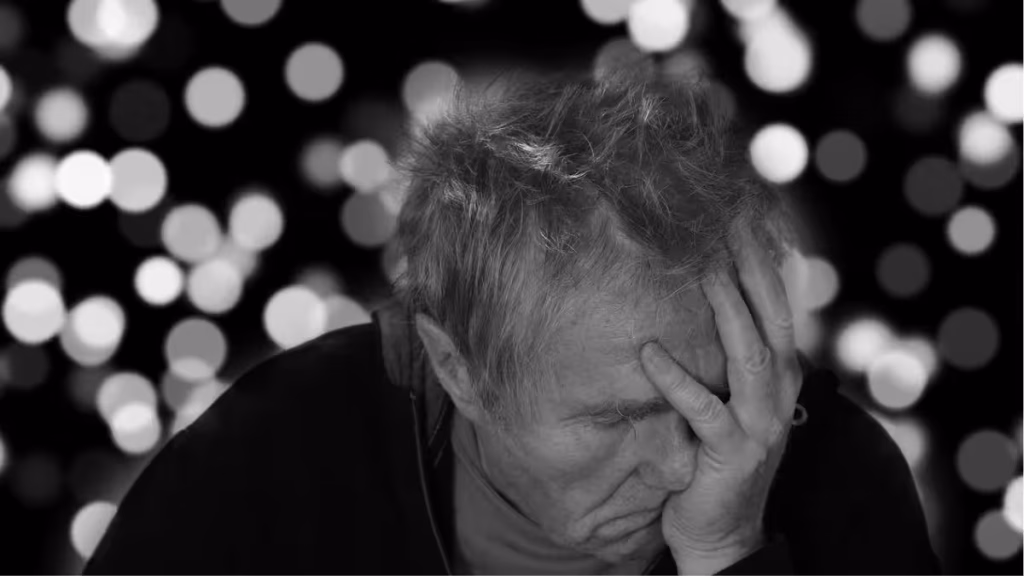 A healthcare professional providing care to an older adult in a healthcare setting.
