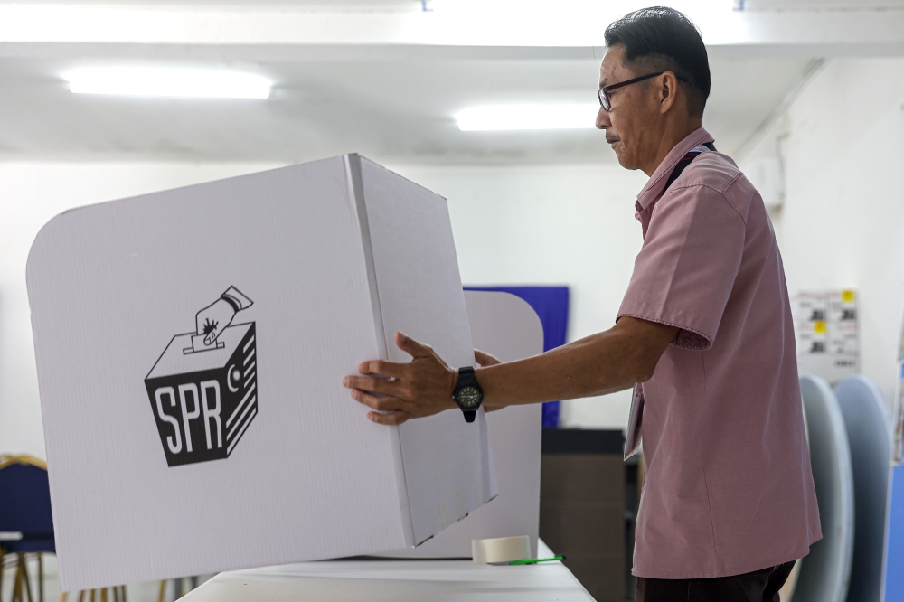 Election Commission officials prepare for the Melaka state election nomination process.